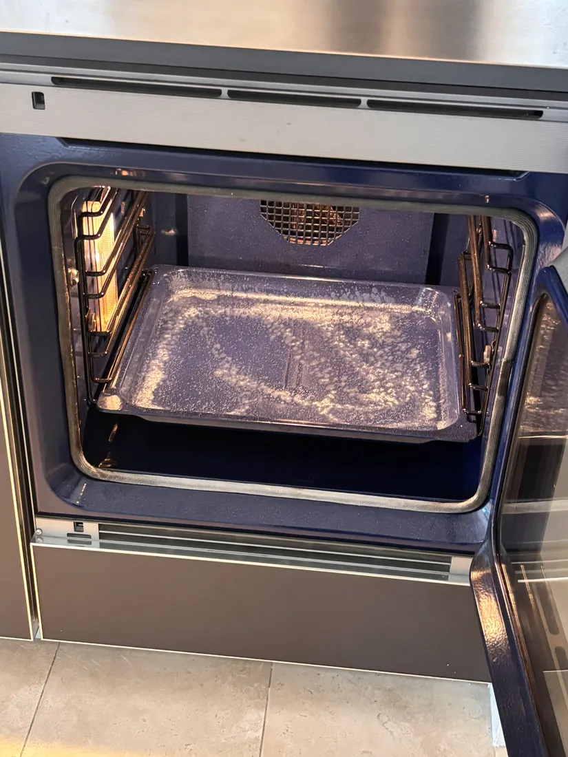 Oven with burnt tray before Lagover deep cleaning