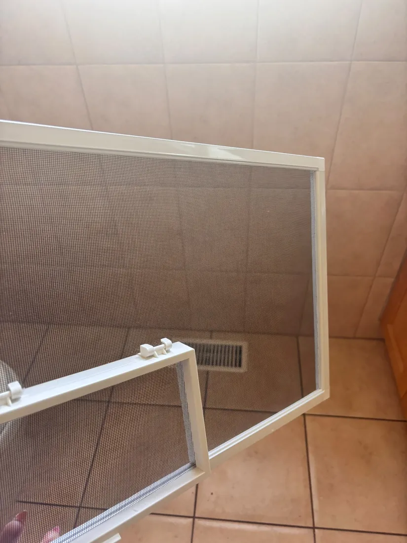 Clean white window screen after Lagover move-out cleaning
